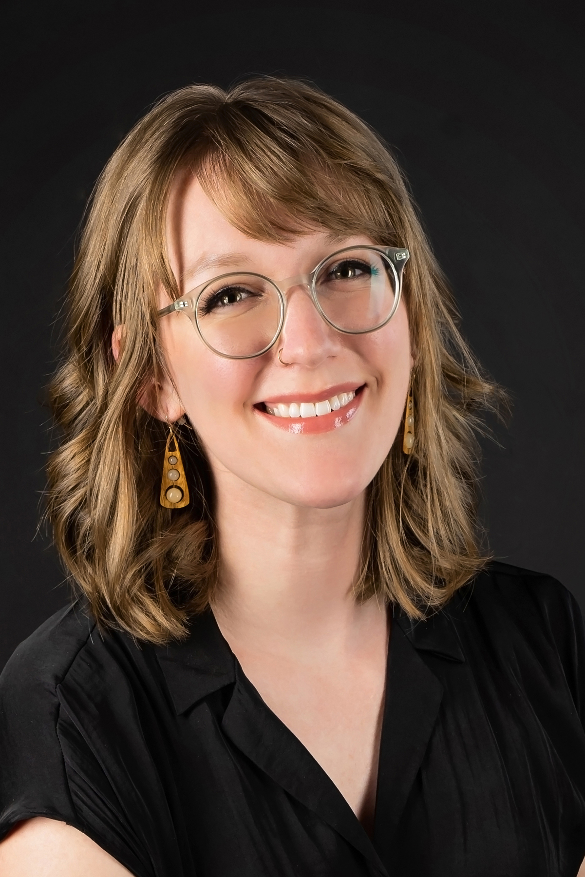 Headshot of Katie, photographer and marketing coordinator at Cranberry Dental Studio